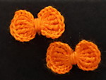 Бантики оранжевые вязаные